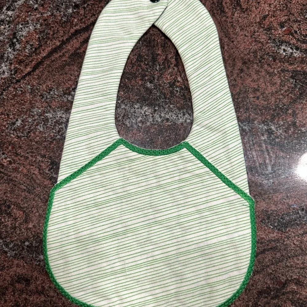 Handmade reversible quilted baby bib in Boston Celtics print